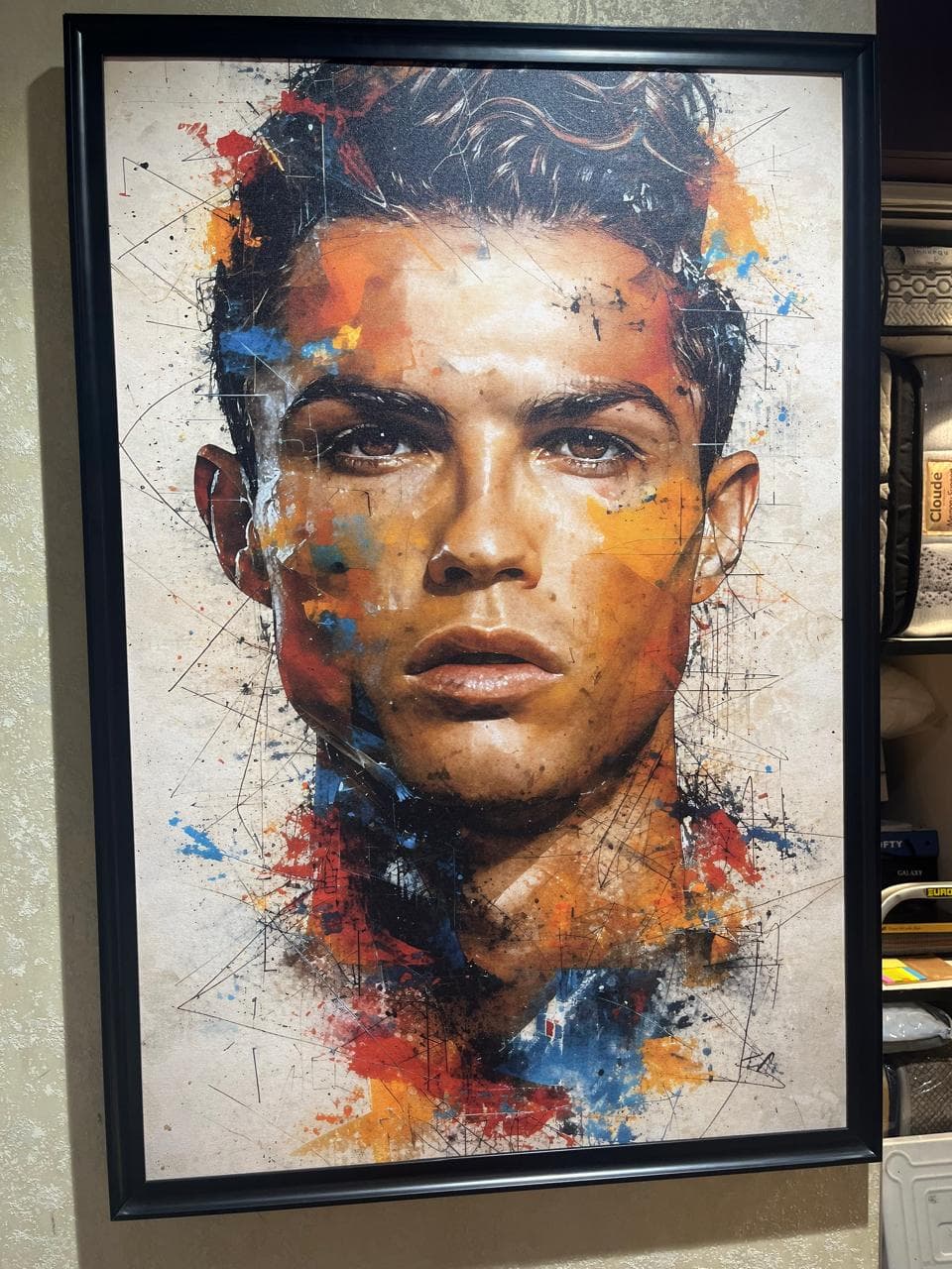 Framed portrait canvas print installed in a residential living room